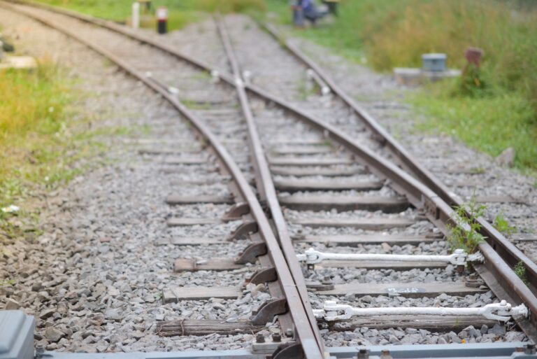 Railway tracks splitting at a switch, symbolizing how creditors attack your clients by diverting cash flow.